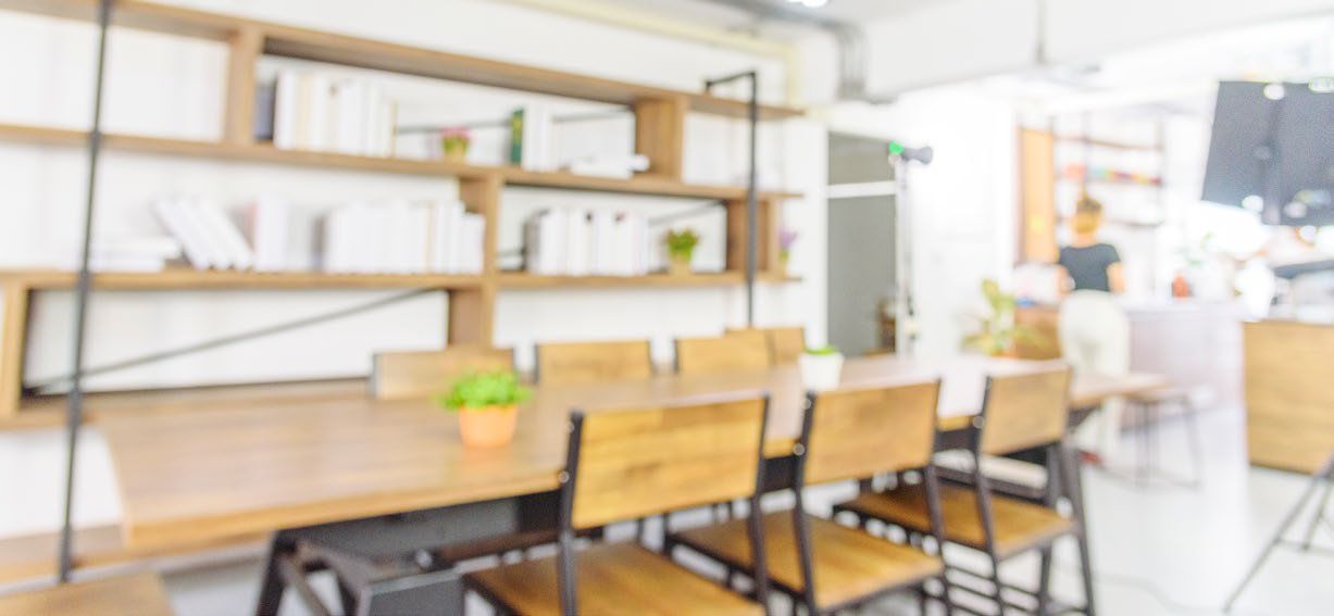 Shared workspace with long wooden tables